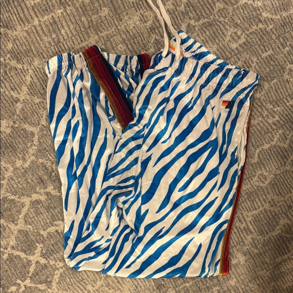 Aviator Nation Blue and White Zebra Print Pants with Red and Gold Stripes
